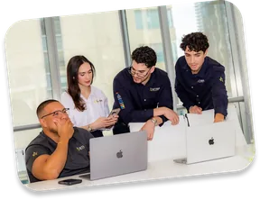 The Astra team reviewing campaigns around a table