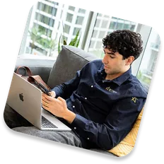 An Astra team member working from a laptop